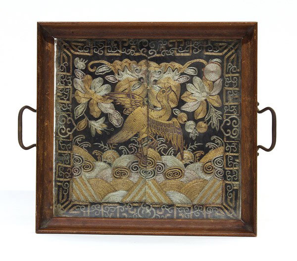 Chinese Rank Badge Inset Tray: Chinese Mandarin rank square mounted into a glazed tray, with a gilt couched bird attached onto the square badge scattered with flower sprigs and cresting waves rendered in metallic wrapped threads, a