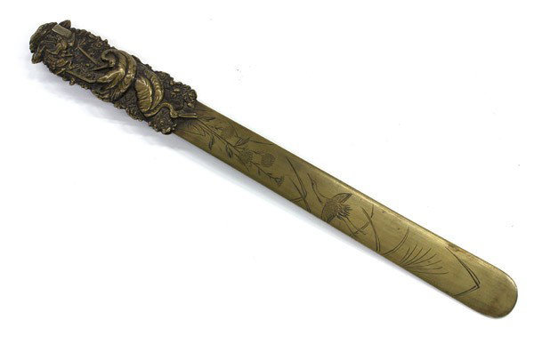 Japanese Bronze Letter Opener, Meiji: Japanese bronze letter opener with mixed metal accents, Meiji period, the handle with a repousse depiction of cranes in a flowering landscape and with a silver-inlaid cartouche [unread], further crane