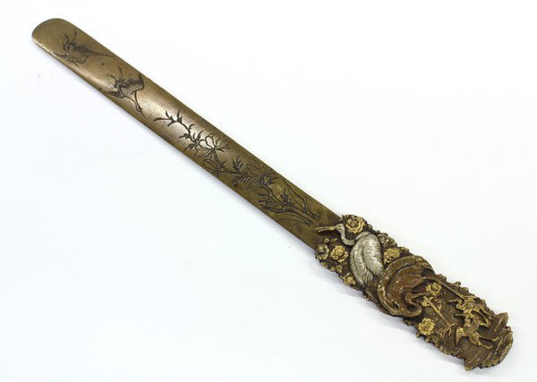 Japanese Bronze Letter Opener, Meiji: Japanese bronze letter opener with mixed metal accents, Meiji period, the handle with a repousse depiction of cranes in a flowering landscape with the details picked out in silver and gold, one side w