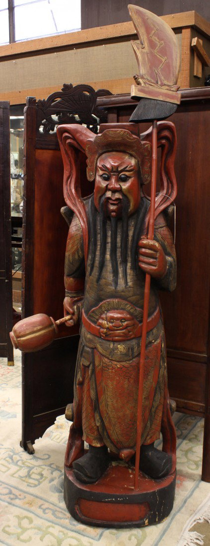 Massive Chinese Wooden Figural Sculpture, Guardian: Chinese large pigment decorated wooden carving of a celestial guardian, the majestic figure adorned in military garb, in formal stance holding a halbert and a mace, figure: 59''h, halbert: over 70''h