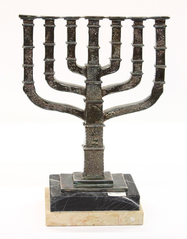 Silver menorah: Silver menorah, the weighted example having repousse detail and rising on a graduated marble plinth, marked 925 on back, 11''h x 8''w