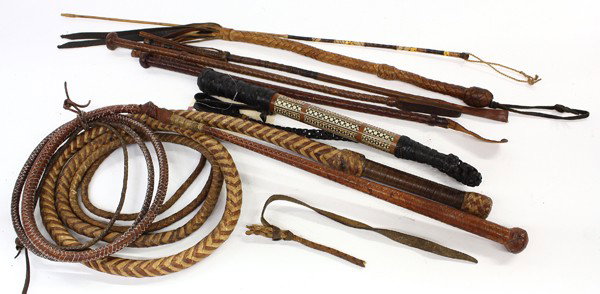 Western items: (lot of 8) Associated horse whips including a California rawhide quirt, Persian style inlaid quirt, two rawhide bull whips, and three English riding crops