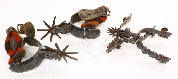 Western spurs: (lot of 4) Two pairs of Western spurs including a pair of Charro iron spurs with silver overlay and decoration having an eight point spoke rowel and leathers covered in wool; together with a pair of W