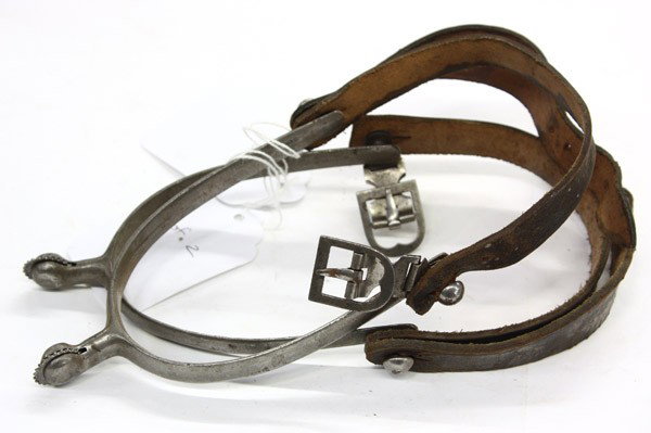 Western spurs: (lot of 48) Associated Western spurs including twelve pairs of spurs mostly U.S. military issue, some signed with Lt. Col. h.S. Halsted Ft. Crook WAN 1944, Lt.Col. Halsted Elite, Skinner 1916, U.S. G.