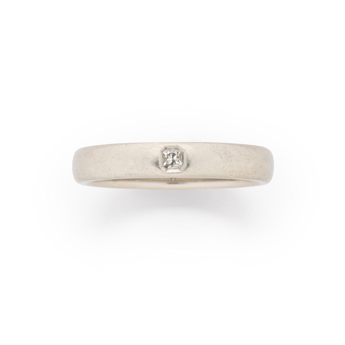 A diamond and platinum ring, 'Lucida', Tiffany & Co.: A diamond and platinum ring, 'Lucida', Tiffany & Co. designed as a polished band, centered by a radiant-cut diamond. 5.6 dwt; size: 9