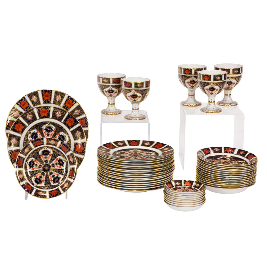 Forty-seven Royal Crown Derby porcelain plates, bowls and goblets: (Lot of 47) Royal Crown Derby porcelain plates, bowls and goblets in the Old Imari pattern 1128, each with printed factory mark, the first group of factory firsts comprising (14) salad plates, 8.5"dia