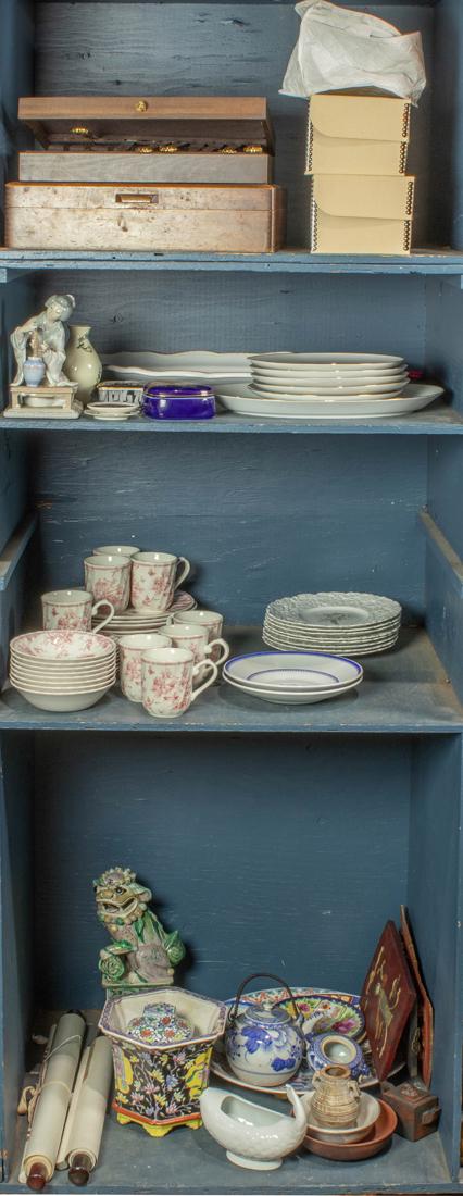 Four shelves of decorative art including Kuba plates: Four shelves of decorative art including Kuba plates, a Churchill china set, etc.