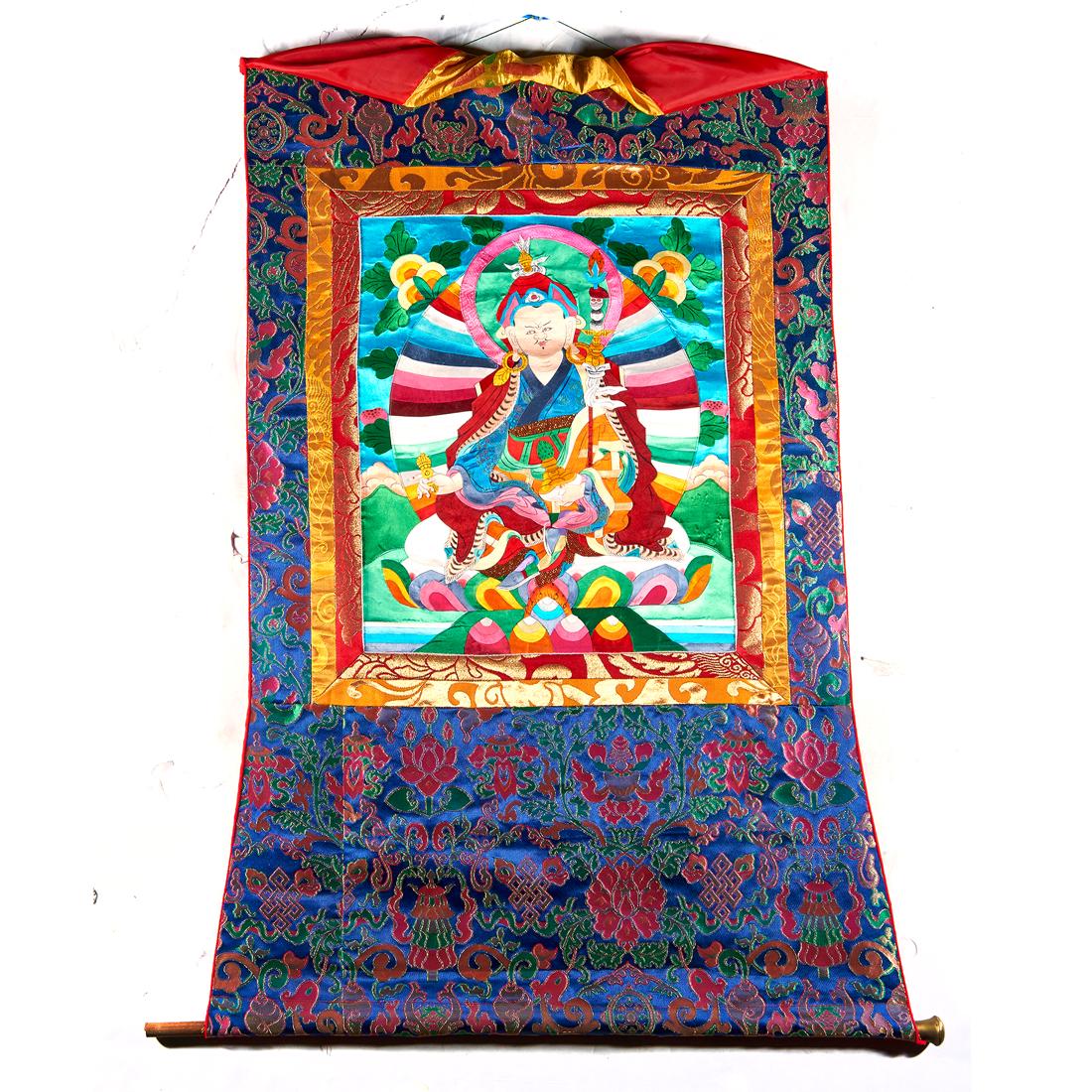Tibetan thangka: Tibetan thangka, depicting Padmasambhava with silk mosaic pieces, mounted in woven silk, 23"h. x 18.5"w.