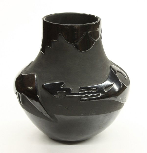 San Ildefonso black ware vase: San Ildefonso black ware vase, having a relief decorated ovoid body and signed 'Tony and Juanita' on base, 10''h x 10''w