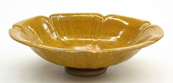 Manuel Jalanivich footed bowl: Manuel Jalanivich (1898-1944) earthenware footed bowl, of sunflower form and having a mustard glaze, signed ''Jalan'' bottom, dated 1923, 4''h x 14''w (restorations)