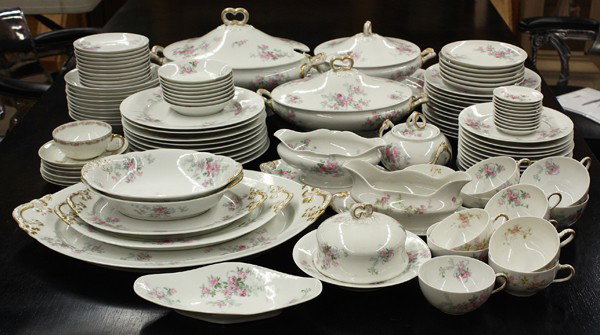 Limoges porcelain table service: (lot of 95) Wm Guerin & Co Limoges porcelain dinner serivice for eight plus extras, each having floral decorated reserves on a white ground, including (9) dinner plates 10'', (11) luncheon plates, (11
