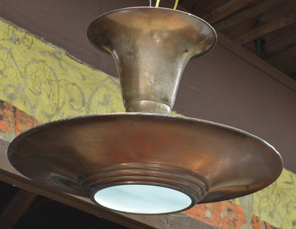French Art Deco light fixture: French Art Deco hanging light fixture circa 1930, having a copper trumpet form support above the saucer form shade with a frosted glass insert, rewired, Provenance: Removed from a French movie theatre