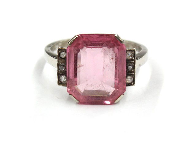 Pink spinel diamond white gold ring: Pink spinel and diamond detailed ring; of 14k white gold, set with (1) emerald cut pink spinel, measuring 13.3 x 11.0 x 4.3mm, accented by (6) European single cut diamonds. Total ring weight 4.0 grams