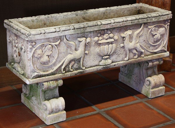 Limestone planter: Carved limestone planter circa 1880, executed in the Renaissance taste, the footed example having a relief decorated winged griffin frieze adorned with grape leaves and rising on outswept feet, 22.5''