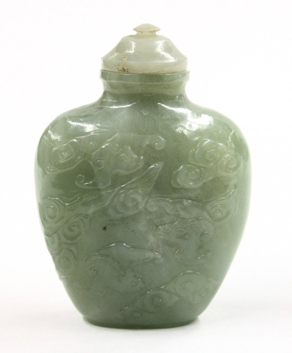 Chinese Carved Jade Snuff Bottle: Chinese green jade snuff bottle, of flattened shield form with a recessed oval base and carved to the front with a flying horse amid cloud scrolls repeated on the reverse with three bats, the mottled 