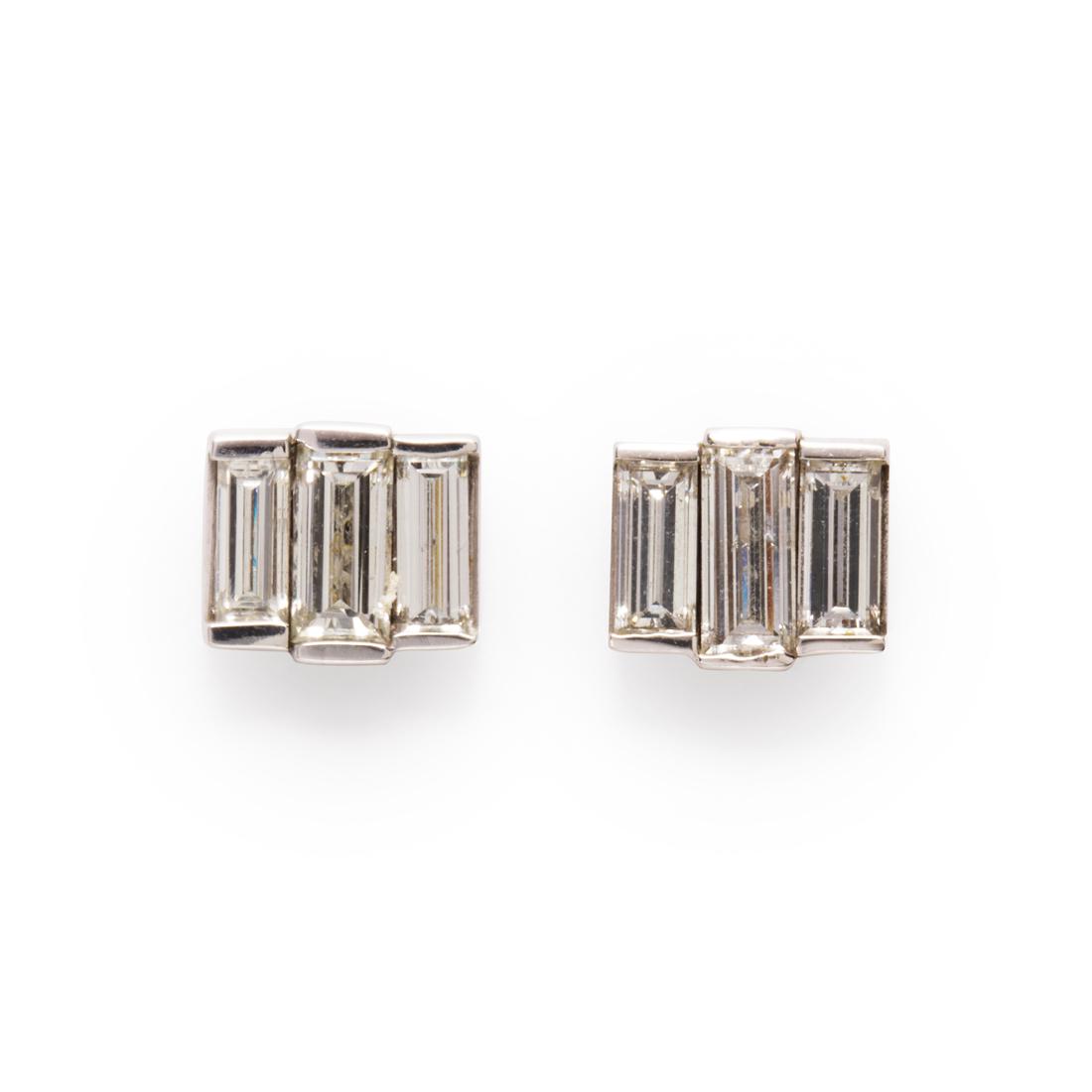 A pair of diamond and fourteen karat white gold earrings (1 of 1)