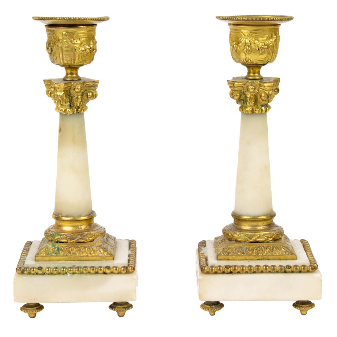 A diminutive pair of Louis XVI style gilt bronze mounted marble candlesticks (1 of 3)