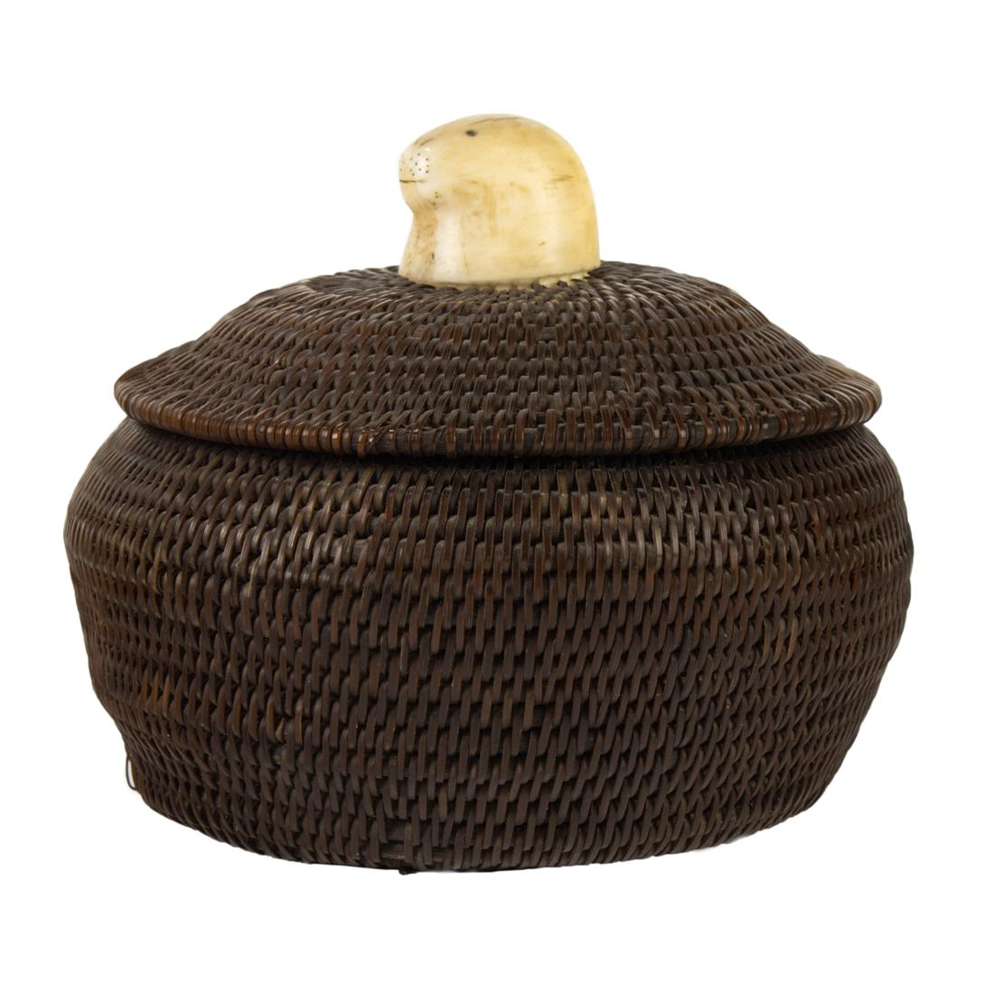 An Eskimo baleen basket with a seal head finial, signed on base "BARROW/1944" (1 of 6)