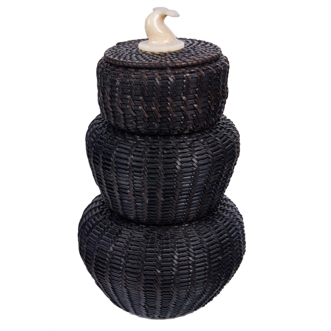 Eskimo triple gourd form baleen basket: An Eskimo baleen triple gourd form stacking basket with a whale fluke top, signed on base "John Hensley, Kotzebue, Alaska" and with the original retail tag, 8"h. Provenance: Bay Area Collector