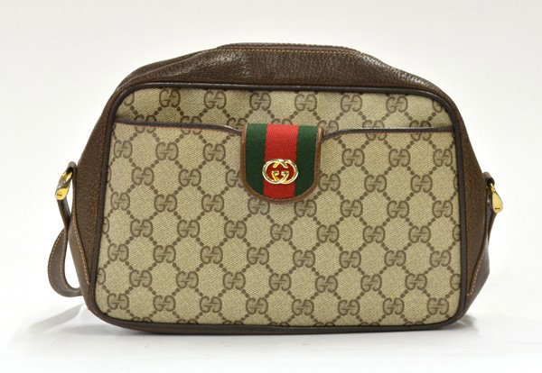 Gucci brown monogram handbag: Gucci brown monogram canvas and brown leather handbag with vintage green and red webbing and gold toned hardware, 7''h x 10.5''w x 2.25''d, shoulder drop 16''