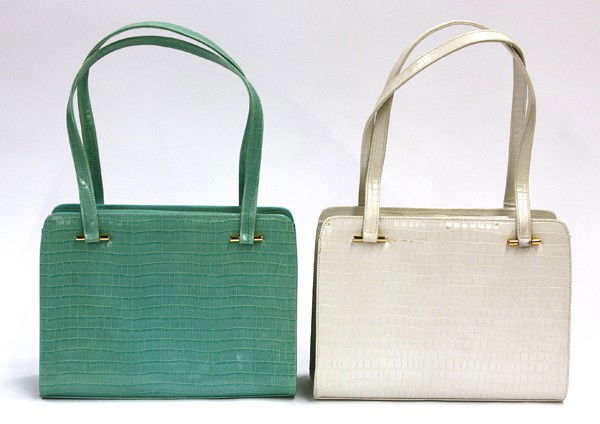 Charles Jourdan embossed crocodile handbags: Two Charles Jourdan embossed crocodile handbags with gold toned hardware, one in mint green, one in ivory, 8''h x 11''w x 4''d, shoulder drop 9''