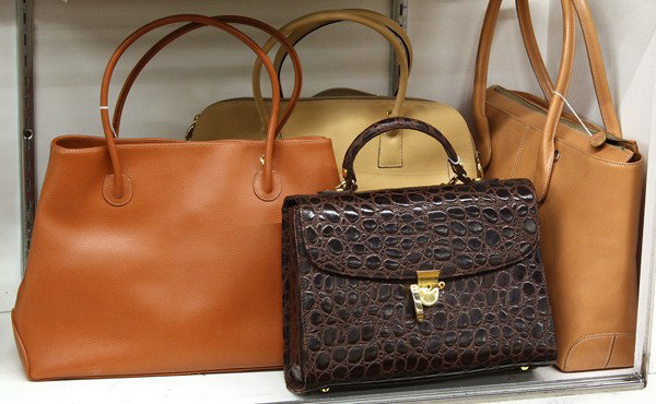 Fashion purses: (lot of 4) Associated Focus and Tods leather purses, including a dark brown aligator handbag, cognac, beige, and tan totes, largest: 10''h x 13.5''w x 4''d, note: latch on brown bag broken