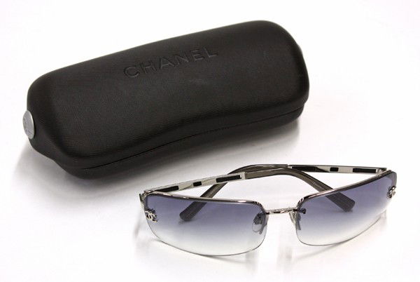 Gucci sunglasses: Pair of Chanel sunglasses with Chanel hard case