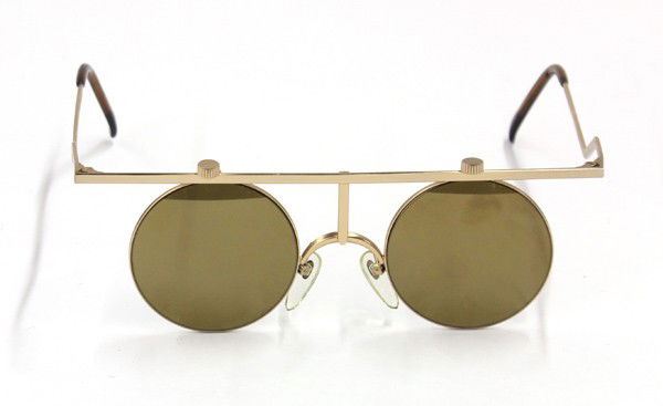 Paulette Guinet sunglasses: Issey Miyake sunglasses, circa 1980, with circular lenses and a matte gilt frames