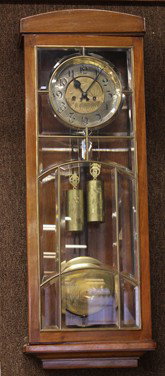 Viennese Gustav Becker regulator clock: Viennese Gustav Becker regulator clock, circa 1900, with a mahogany case with a bevelled glass door, housing the 8 day movement, with a gilt and face and Arabic numerals, the regulator driven by two w