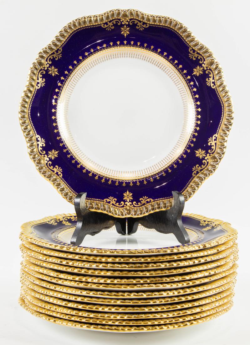 (Lot of 13) Spode bone china cobalt and raised gilt dinner plates in pattern 4469: (Lot of 13) Spode bone china cobalt and raised gilt dinner plates in pattern 4469, third quarter 20th century, each with shaped gadrooned border, printed factory mark and some with impressed date code