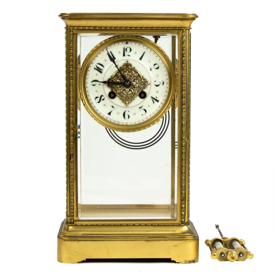 A French gilt brass four-glass mantel clock: A French gilt brass four-glass mantel clock, the Arabic numeral dial with twin train movement sounding on a gong, pastille for S. Martie et Cie, suspending pendulum within upright rectangular case, 12