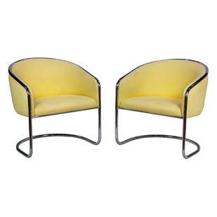 A pair Anton Lorenz for Thonet Cantilevered lounge chairs: A pair Anton Lorenz for Thonet Cantilevered lounge chairs, with pale yellow cotton upholstery above a chromed steel frame, unmarked, 29"h x 26"w, 19.5"d of seat