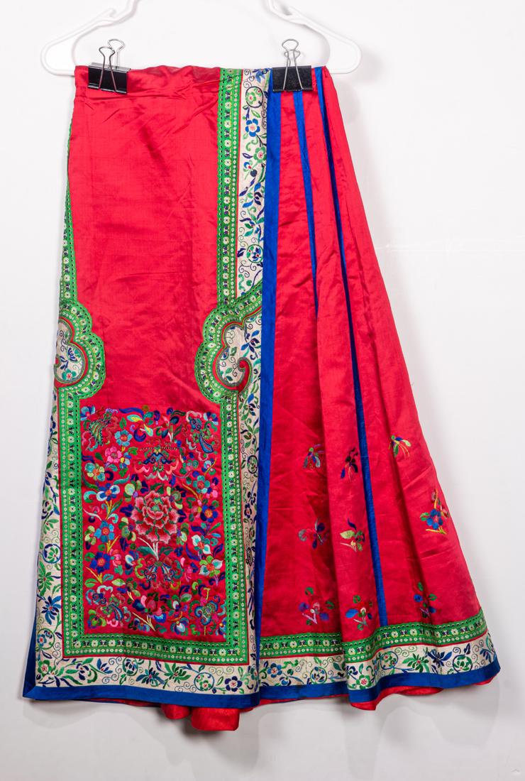 Chinese lady's red ground silk skirt, with fine floral embroidery, length approxiamtely 36".: Chinese lady's red ground silk skirt, with fine floral embroidery, length approxiamtely 36".