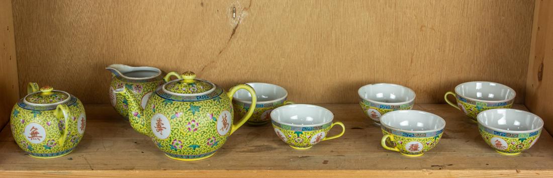Set of famille rose yellow ground tea service: Set of famille rose yellow ground tea service, teapot 8.25"w.