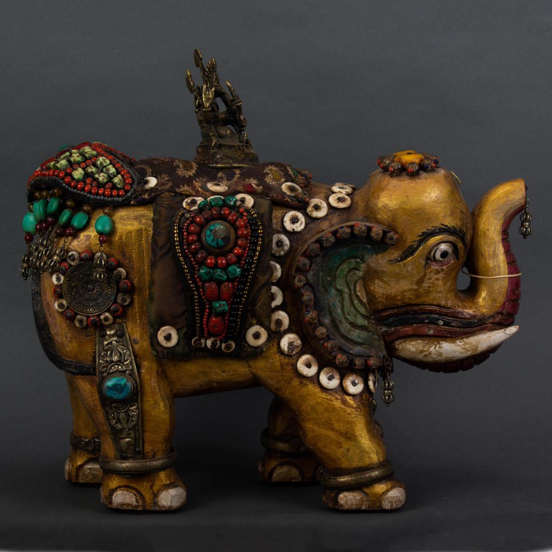 Himalayan gemstone decorated elephant with bronze statue of Ganesh: Himalayan gemstone decorated elephant with bronze statue of Ganesh, decorated with amber, bone, turquoise, malachite, lapis lazuli and coral, 17"h. x 18"l.