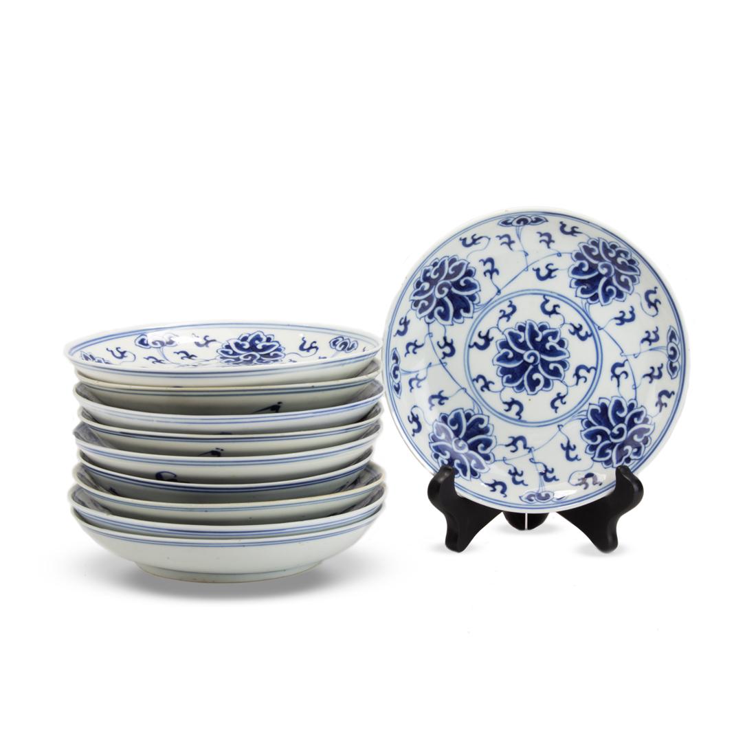 (lot of 10) Chinese blue and white dishes: (lot of 10) Chinese blue and white dishes, each featuring five stylized lotus and scrolling foliage, seven each with a Guangxu mark, two with Xuantong mark, and one with a maker's mark, each width app