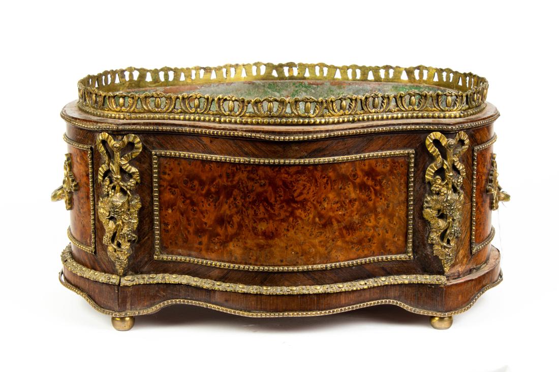 Louis XV style gilt bronze mounted burlwood jardiniere: Louis XV style gilt bronze mounted burlwood jardiniere, of shaped outline with scrolled handles and feet, fitted with tole liner, 7.5"h x 14.75"l x 9.5"d.