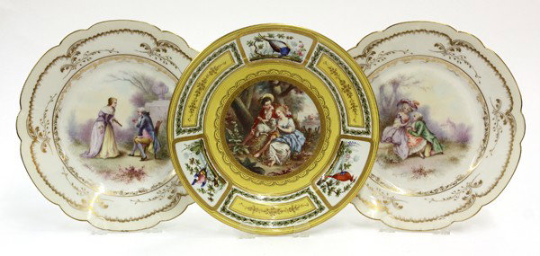 Sevres cabinet plates: (lot of 3) Sevres porcelain cabinet plates including a pair of white ground scallop form with gilt details having central hand-painted Louis XVI style genre scenes, signed Darius; together with a yell