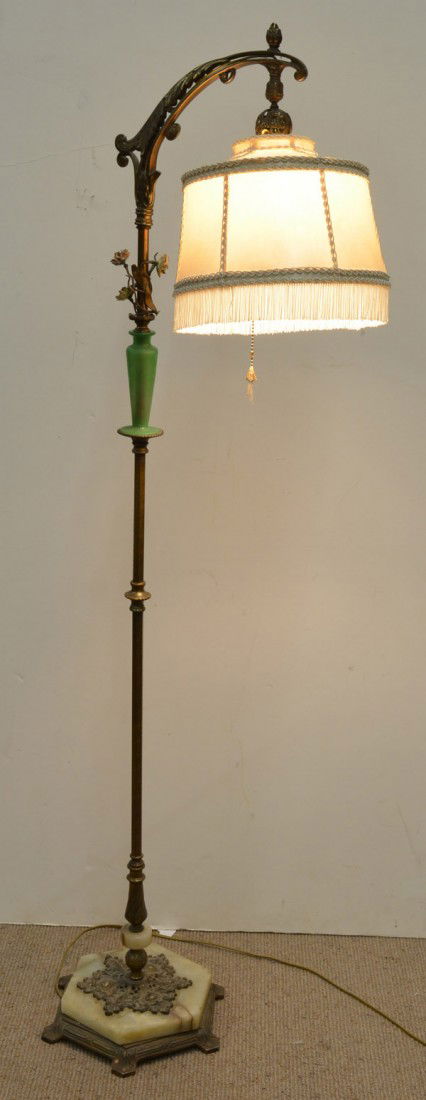 Floor bridge lamp: Floor bridge lamp, circa 1930, with a gilt finish, raised on a standard with a green glass vase and bouquet, the whole rising from an onyx base, 62''h x 11''w x 11''d