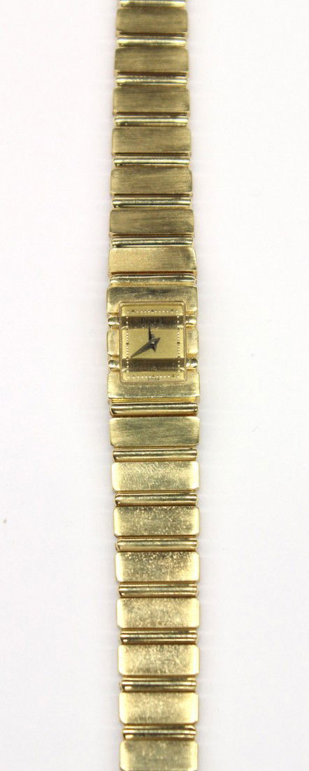 Lady's PIAGET Polo quartz wristwatch: Lady's Piaget Polo quartz wristwatch; of 18k yellow gold, dial having raised markers and sapphire crystal. Reference #15201 C701. Serial #437517. Total watch weight 76.3 grams. Including box and opera