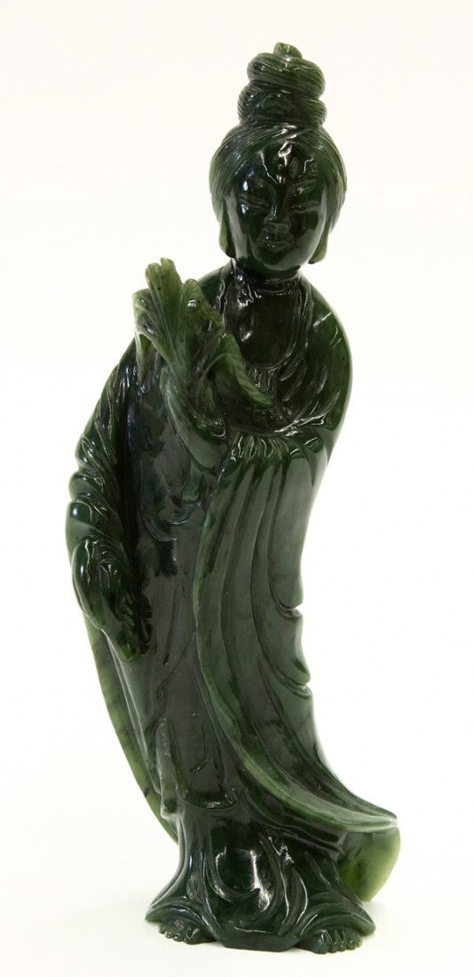 Chinese Spinach Jade Figure of a Beauty: Chinese spinach jade carving of Guanyin, standing in long flowing robes with an amphora in her left hand, the other with a leafy willow branch, the smiling face framed by a coiffure with a tall chigno