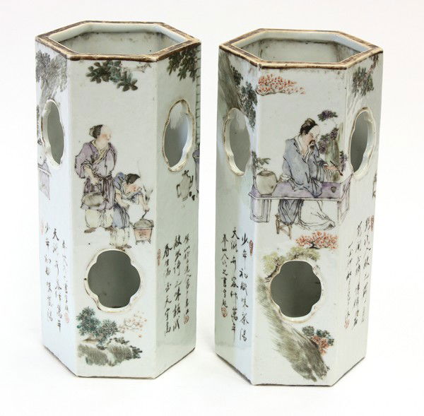Two Chinese Enameled Porcelain Hat Stands: (lot of 2) Chinese polychrome enameled porcelain hat stands, each of hexagonal section with the exterior pieced with lobed openings and enameled with a mirror image of scholars in elegant pursuits alo
