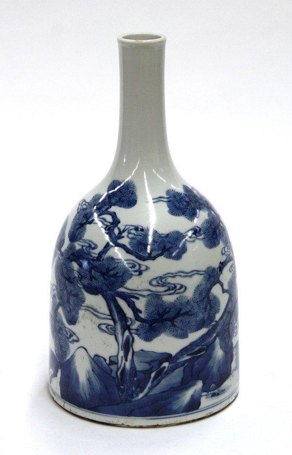 Chinese Blue-and-White Porcelain Bottle Vase: Chinese underglaze blue decorated porcelain bottle vase, of modified hoof from (matizun) and decorated with a pair of cranes and deer along with two gnarled pines, the recessed base marked 'Kangxi gui