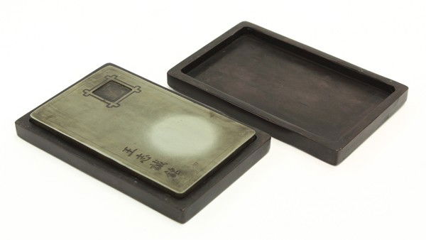 Chinese Songhua Ink Stone and Stone Box: Chinese songhua ink stone and stone box, the green hue ink stone with with a small rectangular well to the upper right corner framed, the lower left reads 'Wang Zhicheng ming'; together with a rectang