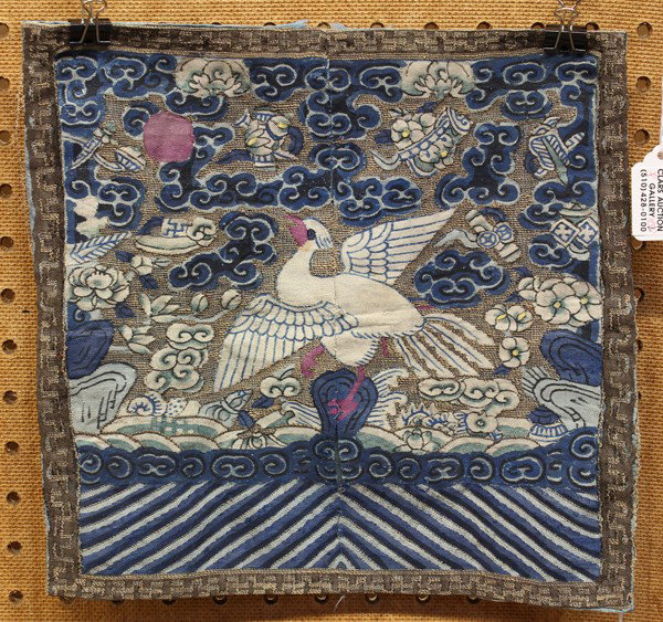 Two Chinese Rank Badges (Mandarin Squares): (Lot of 2) Chinese civil service rank badges, the first couched with gilt wrapped threads and depicting a bird perched on a rock amid a sky scattered with the Eight Buddhist Emblems and clouds, the se