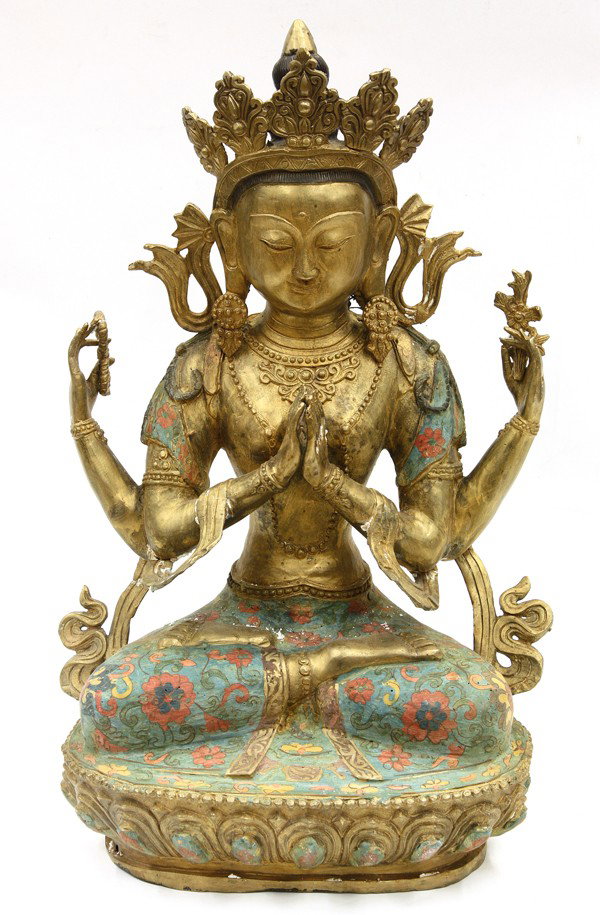 Chinese Gilt Metal Buddhist Figure, Tara: Chinese gilt metal figure of a female bodhisattva, probably depicting Tara in a four-arm manifestation, the slender figure clothed in multicolored garments simulating cloisonne enamel and adorned with