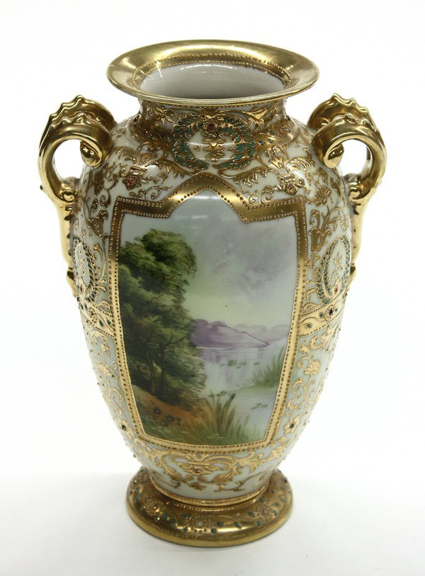Nippon scenic vase: Nippon scenic vase, having a raised gilt and enamel decorated body centering the alternating scenic landscapes, and rising on a circular foot, 10''h x 7''w