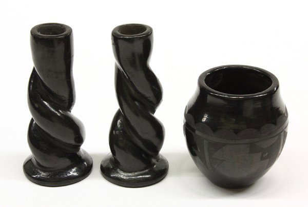 Santa Clara blackware group: (lot of 3) Santa Clara black ware consisting of a pair of spiral twist candle holders signed Juanita 6.5''h, together with a bulbous vase by Barbara Martinez, 4.5''h x 4''w