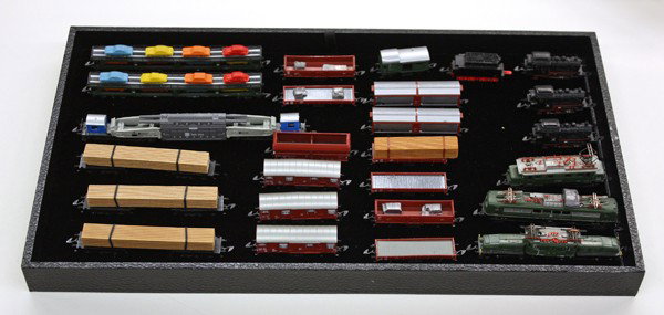 Marklin mini-club Z railroad engines carriages: One shelf of Marklin mini-club Z scale model railway engines and carriages, scale of 1:220, includes steam passenger with tender, two Schienenreinigungswagen, rail bus, Crocodile locomotive, three tan