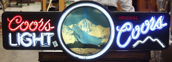 Neon Coors beer sign: Neon Coors beer sign, one side displaying Original Coors, the other, Coors Light, each flanking the central scene of the firms classic Rocky Mountain logo